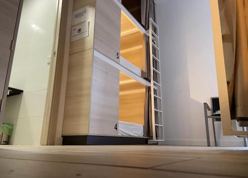 a hallway with a staircase in a building at Hostel Casa Vargas Figueroa in Cáceres