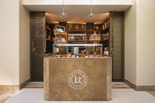 a lobby with a bar with a sign on it at Sheraton Cascais Resort - Hotel & Residences in Cascais