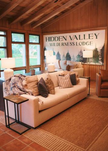 a living room with a couch in a room at Hidden Valley Wilderness Lodge in San Ignacio