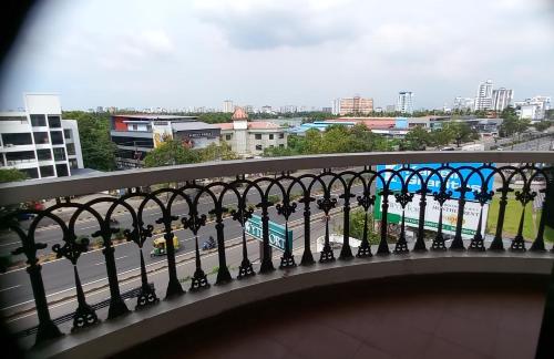 a balcony with a view of a city at THE WYTE FORT in Cochin