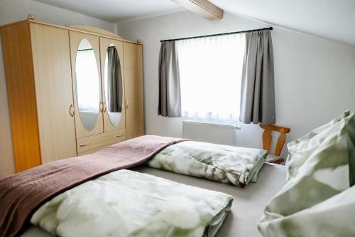 Postel nebo postele na pokoji v ubytování Haus Michaela