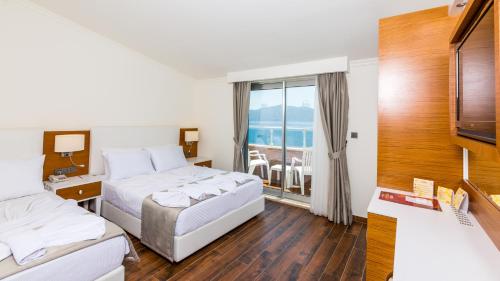 Katil atau katil-katil dalam bilik di Ketenci Otel