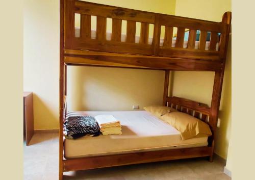 a wooden bunk bed in a room at Paraíso Costero en Alquiler in Playas