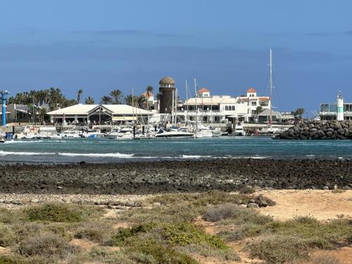 a view of a marina with boats in the water at Las Rocas 115 - Fuerteventura Golf Club in La Guirra