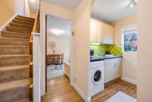 a laundry room with a washer and dryer at Stylish Short Term Let - Bucks in Bourne End