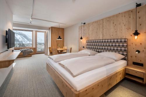 Ένα ή περισσότερα κρεβάτια σε δωμάτιο στο Apparthotel Zirbenhof