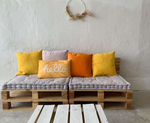 a bench with pillows on it in a room at Casa Alba 2023 in Lillo