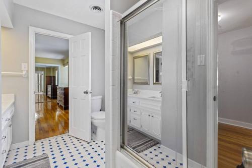 a bathroom with a toilet and a glass shower at The Swan in Petersburg