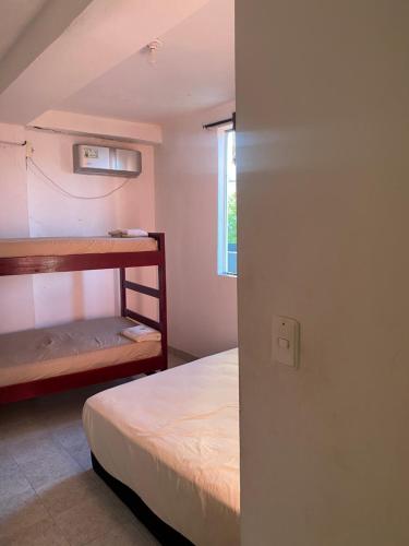 Postel nebo postele na pokoji v ubytování Posada Casamar2 alojamiento en San Andrés islas