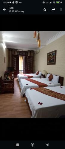 a room with a bunch of beds in it at Holiday home in Hanoi