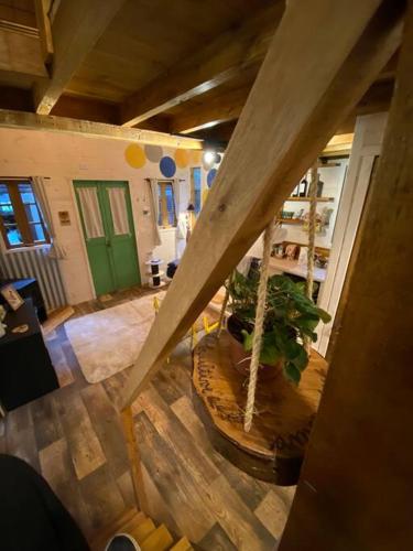 an overhead view of a living room with a plant at Cabana Lara, com lareira e muito estilo. in São Francisco de Paula
