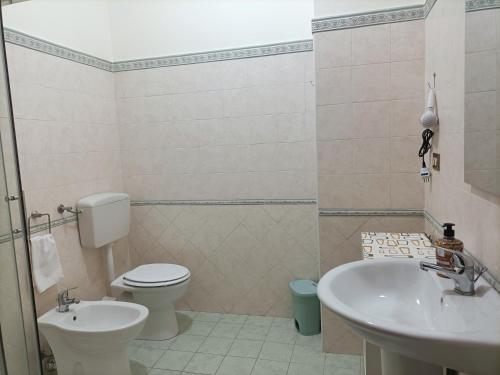 a bathroom with a toilet and a sink at Palermho in Palermo