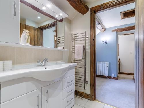 a bathroom with a sink and a mirror at 2 Bed in Longnor 78661 in Longnor