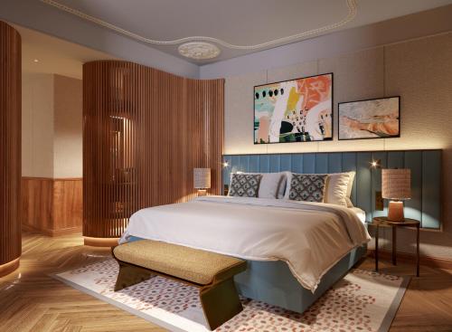 a bedroom with a large bed in a room at Grand Hotel Central, Small Luxury Hotels in Barcelona