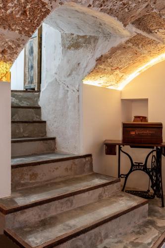 an abandoned room with stairs and a piano at Antiguo Brondo Selfcheck-in Smart Rooms in Palma de Mallorca