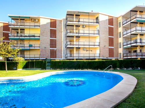 a large swimming pool in front of a building at Apartment Vista del Arenal by Interhome in Jávea