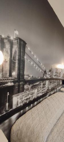 a black and white photo of a building with a mural at Hotel Everest Arco in Arco