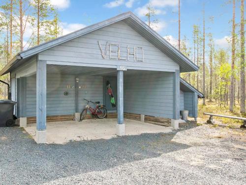 a garage with a bike parked in it at Holiday Home Velho 2 by Interhome in Saariselka