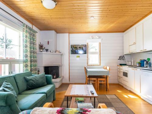 a living room with a couch and a table at Holiday Home Urupää c 13 by Interhome in Saariselka