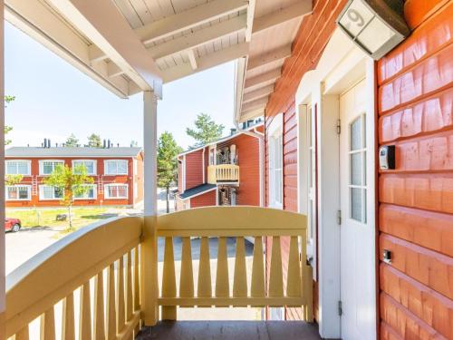a porch of a home with a wooden railing at Holiday Home Outapailakka j 9 by Interhome in Saariselka