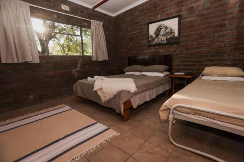 Ένα ή περισσότερα κρεβάτια σε δωμάτιο στο Leeurivier Veldhuis