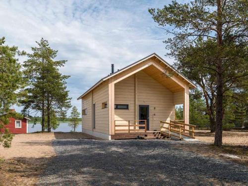 a small house with a large porch at Holiday Home Siika by Interhome in Hailuoto