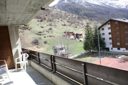 a balcony with a view of a mountain at Monte Rosa Apartments Täsch in Täsch