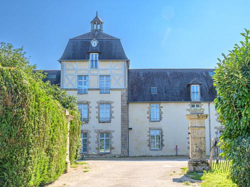 an old building with a clock tower on top of it at Apartment Le Château de Kergonano-8 by Interhome in Baden