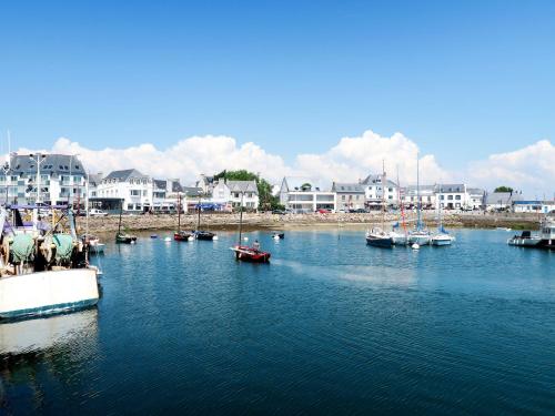 a group of boats docked in a body of water at Holiday Home la chaumière de Quélarn by Interhome in Plobannalec-Lesconil