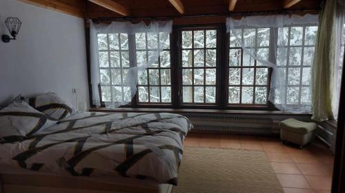 Postel nebo postele na pokoji v ubytování Beskidzka Apartments