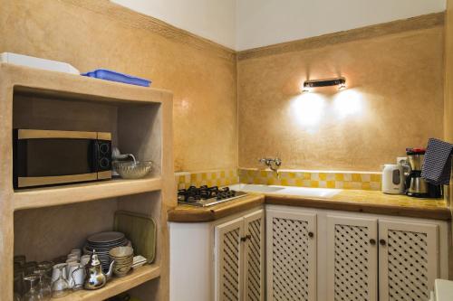 Η κουζίνα ή μικρή κουζίνα στο Jack's Apartments & Suites