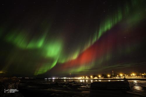 an image of the northern lights in the sky at River Apartments in Selfoss
