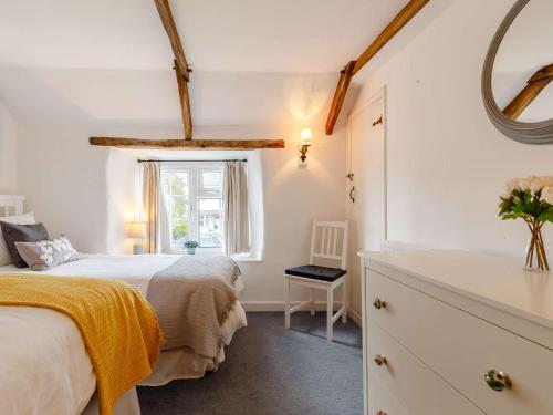 a bedroom with two beds and a window at 2 bed property in Wadebridge 87231 in Egloshayle