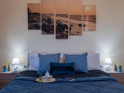 Кровать или кровати в номере Holiday Home Stazzu lu Bulioni by Interhome