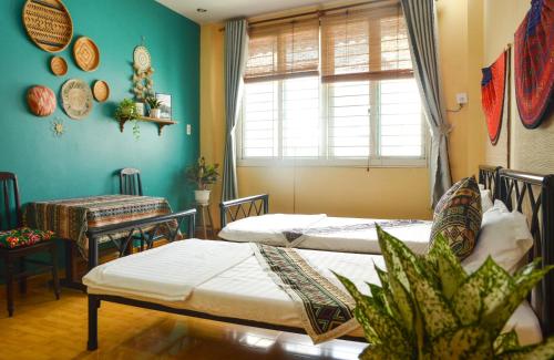 Кровать или кровати в номере Northern Hostel - Bui Vien Walking Street