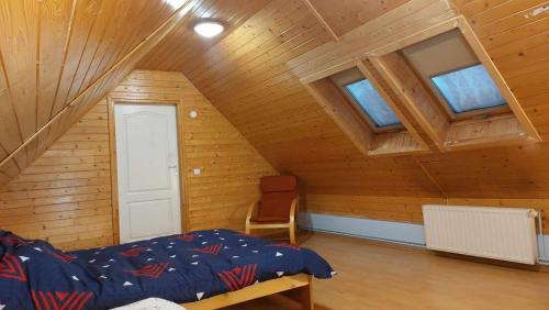 Postel nebo postele na pokoji v ubytování Beskidzka Apartments