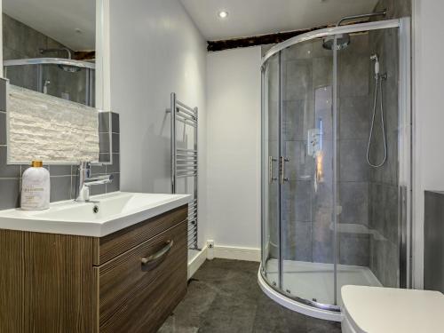 a bathroom with a shower and a sink at 3 Bed in Brecon 88249 in Brecon