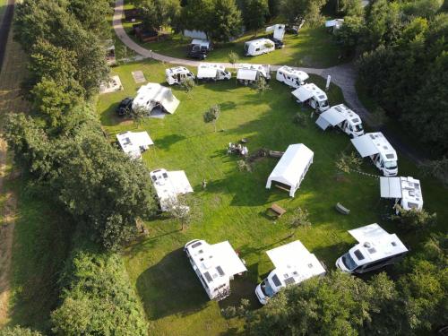 an aerial view of a group of camper vans parked in a field at Camping Heidekamp in Versmold