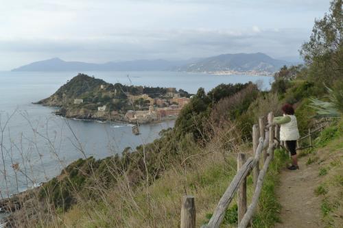 a woman standing on a hill looking at the ocean at La casa dei Paggi in Sestri Levante
