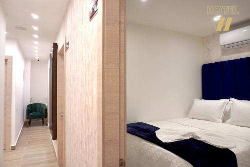 Una cama o camas en una habitación de HOTEL W Santa Marta