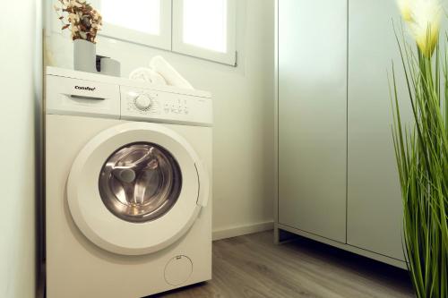 a white washer and dryer in a laundry room at BnB Il Bicciolano in Vercelli