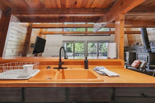 a kitchen with a sink and a counter top at Charming Strawberry Cabin with Private Deck in Strawberry