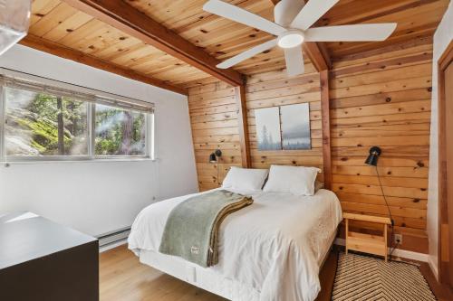 a bedroom with a bed and a ceiling fan at Charming Strawberry Cabin with Private Deck in Strawberry