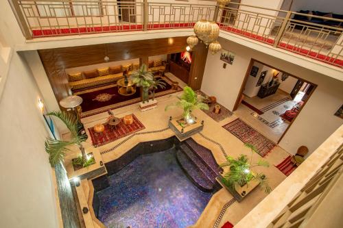 an overhead view of a hotel lobby with a pool at Riad Kenza in Marrakech