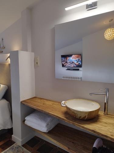 a bathroom with a tub on a wooden counter at El Cielo de Cebreros in Cebreros
