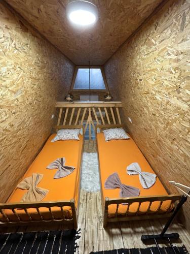an overhead view of a room with two bunk beds at Bungalov Dunja in Podgorica