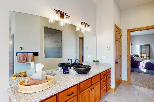 a bathroom with a counter with a sink at High Country Pool House in Sturgis
