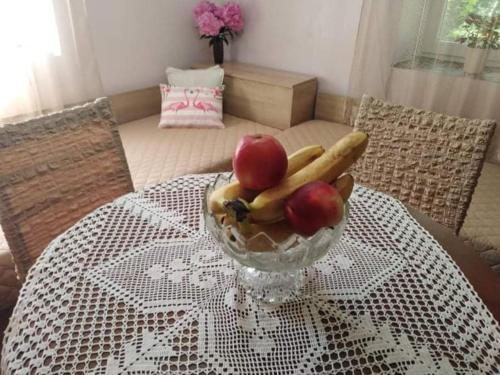 a bowl of apples and bananas on a table at Lovely studio in Dragoman with garden and garage in Dragoman