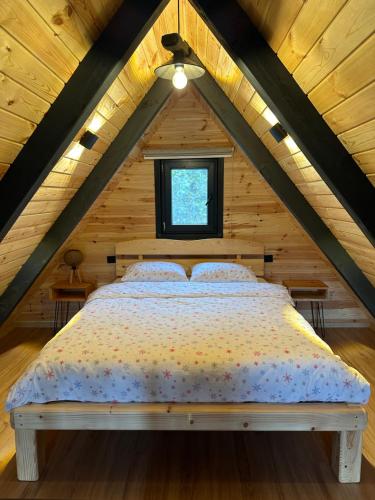 a bedroom with a bed in a attic at Hanifta Bungalows in Trabzon