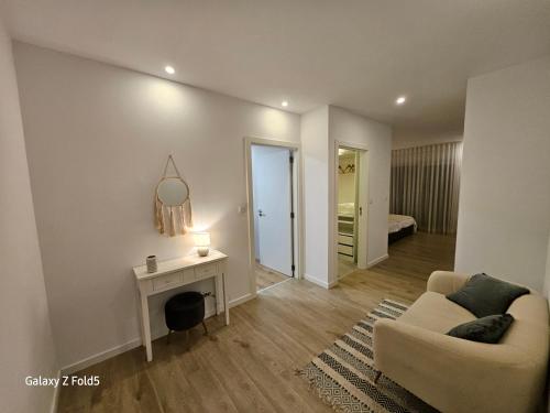a living room with a couch and a table at One of a Kind #PDL Luxury Retreat in Ponta Delgada